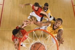 Young men playing basketball