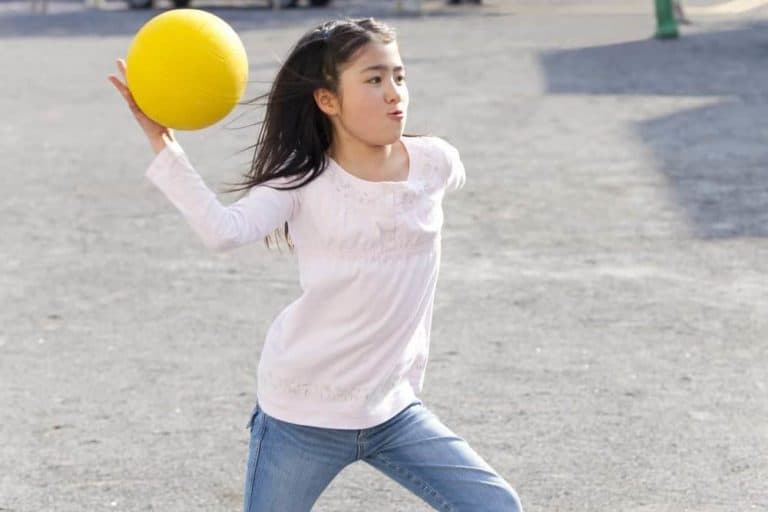 Girl playing dodgeball