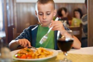 Kid eating lunch at a restaurant