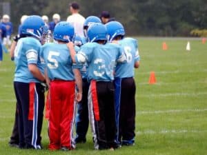 Flag football team huddle during Gatlinburg sports tournament