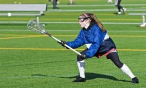 Teenage girl playing lacrosse in Gatlinburg