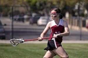 Young woman playing Lacrosse in Gatlinburg
