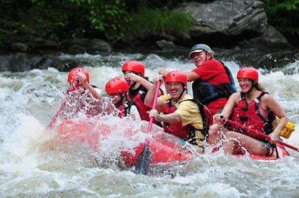 Group white water rafting on the Pigeon River, one of the most popular sports in Gatlinburg.