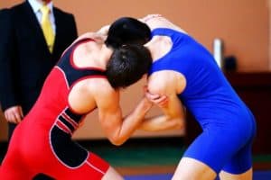 Two men competing in a Smoky Mountain wrestling tournament.