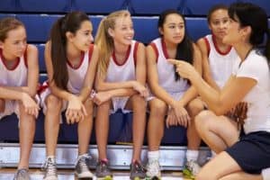 A basketball team of young women and their coach at our Gatlinburg sports complex.