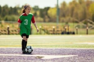 A girl playing soccer at our Smoky Mountain sports complex.