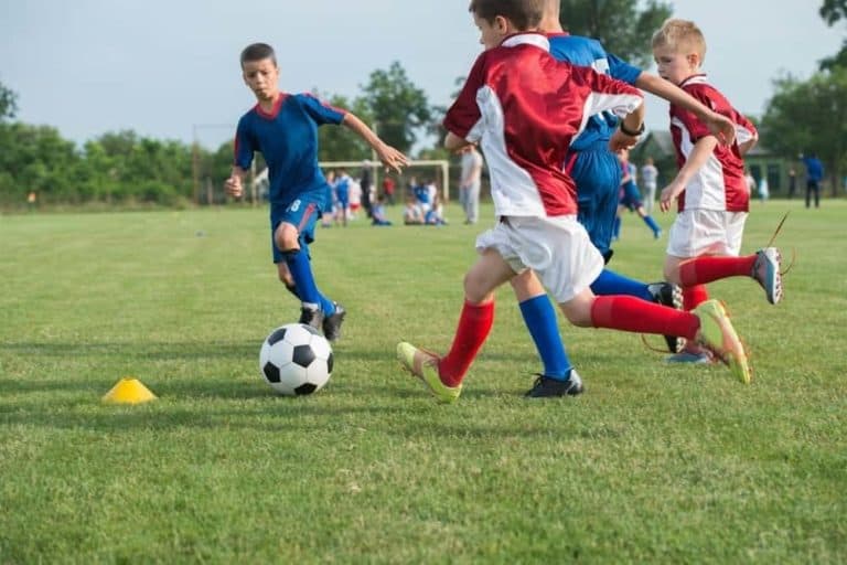 Young athletes playing soccer.