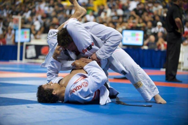 Two athletes competing in a grappling tournament.