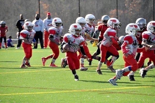 Young boys playing football.