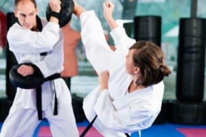 A woman training in taekwondo.