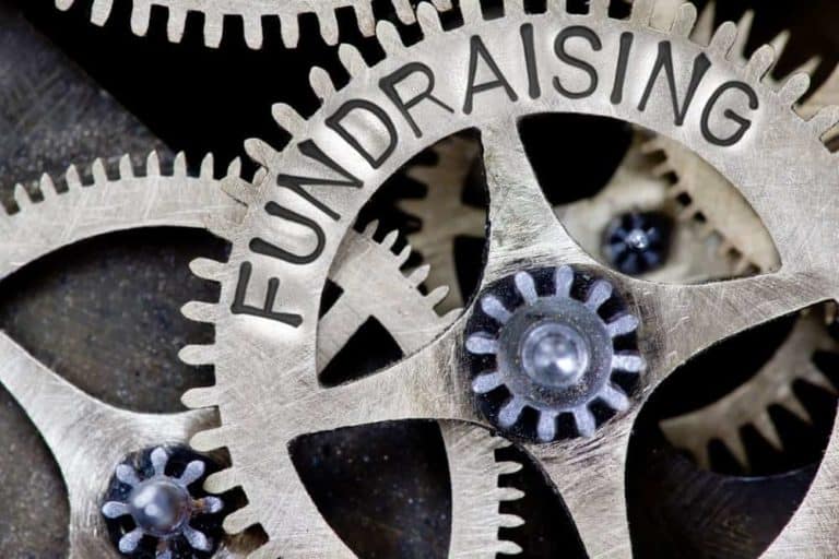 A gear with the word Fundraising on it.