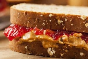 A peanut butter and jelly sandwich on whole wheat bread.