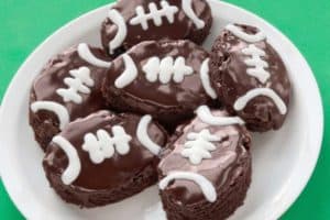 Football-shaped brownies with icing.