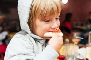 kid eating pizza in Smoky Mountains