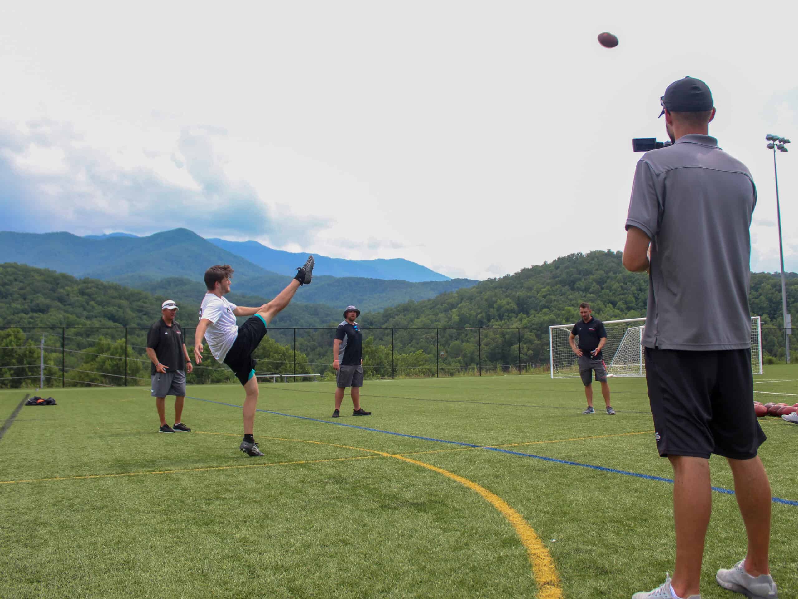 Kohl's Camp participant learning punting skills