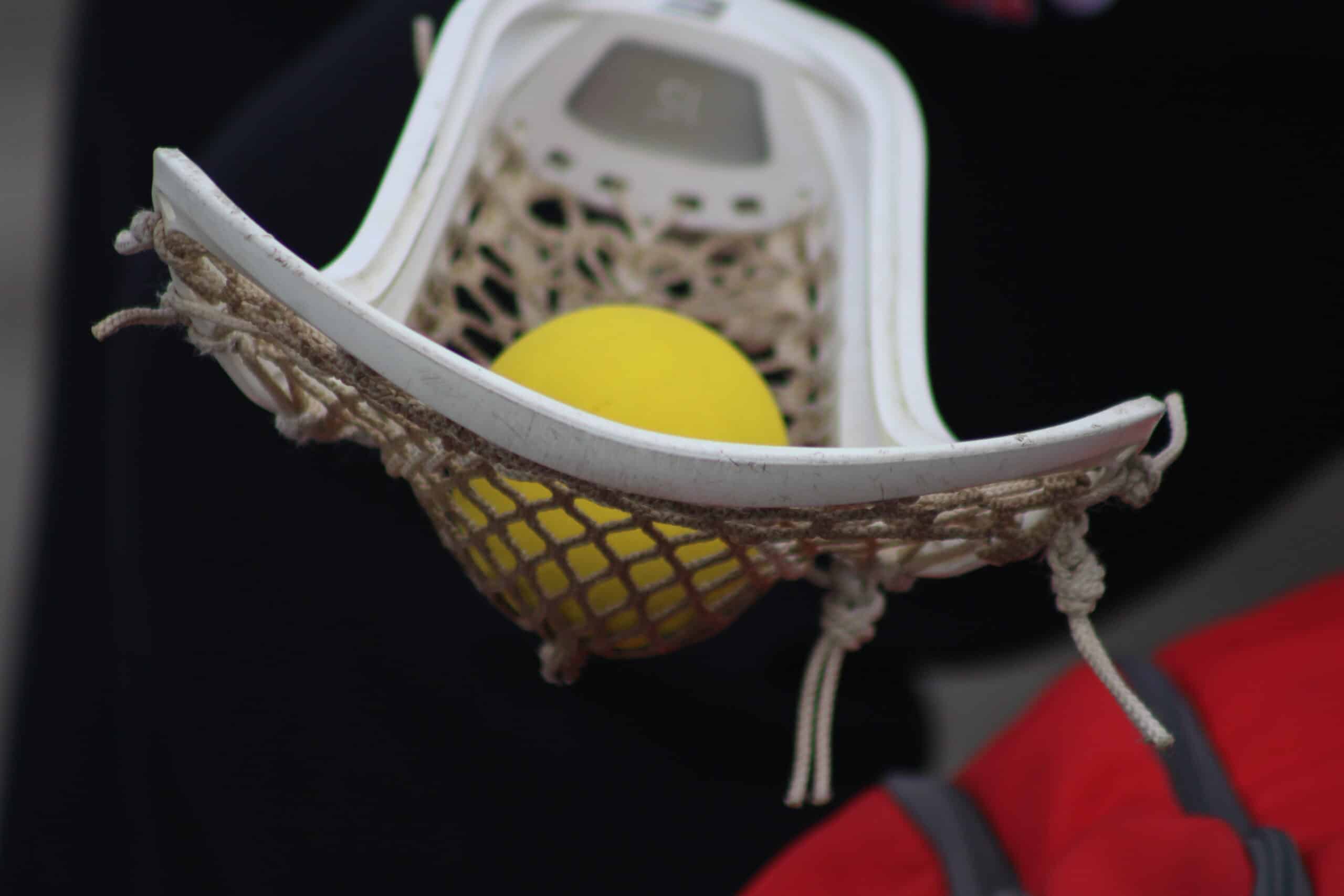 lacrosse ball in the basket of a stick