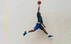 basketball player going up with the ball