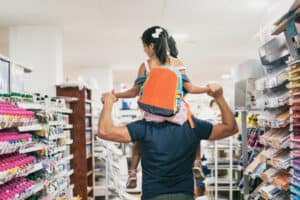 dad and daughter backpack shopping