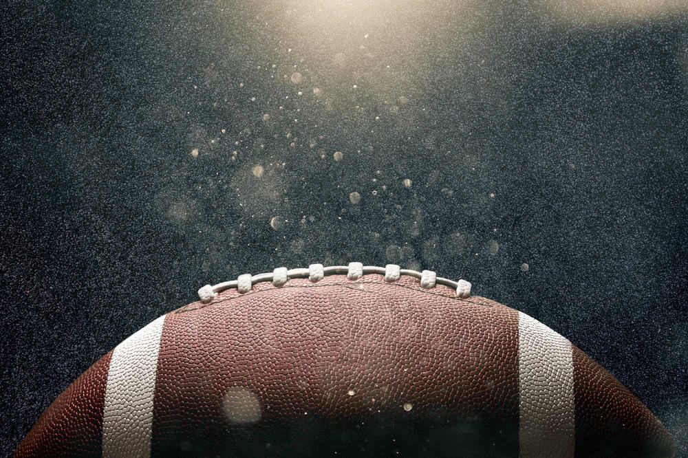 football against black background