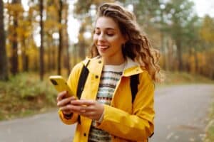 woman on walk checking phone